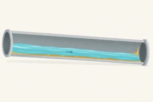 Coupe d’une canalisation où la graisse se dépose malgré le passage de l’eau